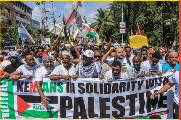 Members of the muslim community in Kenya hold banners as they wave Palestinian flags and chant slogans during a demonstration in solidarity with Palestine in Mombasa on October 21, 2023. Thousands of people, both Israeli and Palestinians have died since October 7, 2023, after Palestinian Hamas militants based in the Gaza Strip, entered southern Israel in a surprise attack leading Israel to declare war on Hamas in Gaza the following day. (Photo by STRINGER / AFP)