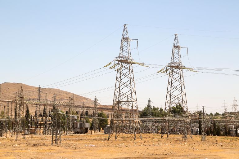 FILE PHOTO: A view shows electricity pylons in Kiswah, Damascus suburbs, Syria September 8, 2021. Picture taken September 8, 2021. REUTERS/Yamam al Shaar/File Photo